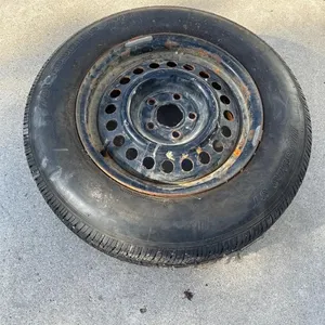 185 75 R 14 tire on rim.