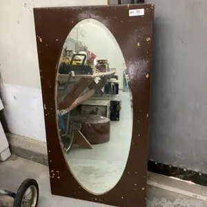 BEVELLED OVAL MIRROR IN PLYWOOD FRAME