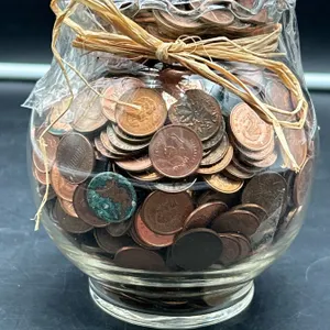 Glass Jar Filled with Assorted Pennies