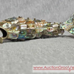 Abalone Articulated Fish Bottle Opener. Has a little damage to its mouth and missing a few scales. DR