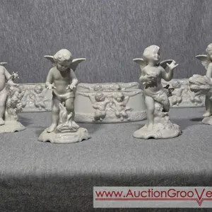 Dresden Porcelain Angel Cherub Center Pieces. Cherubs are 3.5 x 6 and the Vases / Flower Frog 6 x 2 x 2. DR