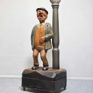 Italian Wood Carved Bottle Opener and Cork Screw Music Box. Man leaning on a Light Pole. Plays Isola Di Capri. 4.5 x 3.5 x 12. BR1