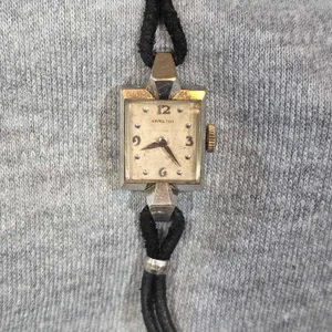 14K White Gold Hamilton "VICKI" model Women's Watch. Watch without the bands weight is approximately 8g. Clasp is marked 1/20 10k GF. HS