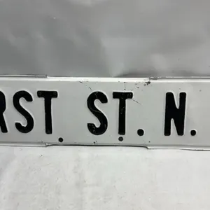 Vintage First St NW Embossed Steel Street Sign