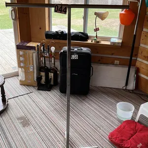 OFFSITE - Telescoping clothing rack.