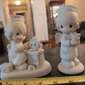 2 Precious Moments Nurse figurines