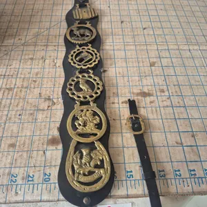 Vintage horse brass on a leather strap
