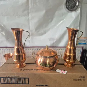 Potpourri holder and 2 copper pitchers.