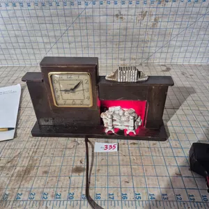 Mid-century 1940s, United mantel clock,  works with lighted fireplace.