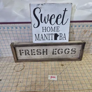 2 wooden signs.