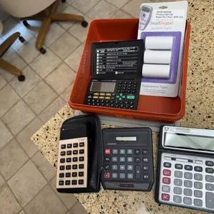 Tupperware container, calculators