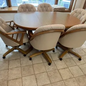 Dinette set, oblong table, rolling arm chairs (6)