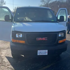 2014 GMC Savana 3500 G33405 cargo van. Powered by a Vortec engine. Features cargo area shelving and a cabin partition. VIN: 1GTZ7TBG2E1132578. Odomete