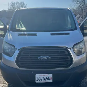 2015 Ford Transit 250 cargo van. 3.7 V6 engine Features a 130" wheelbase, silver exterior, interior cargo shelving, partition bulkhead, and front buck