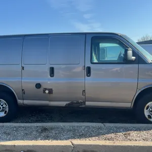 2010 GMC Savana cargo van. Features interior cargo shelving, safety partition bulkhead, and 6.0  FlexFuel engine. Shows 286,758 miles. VIN: 1GT2GTAGXA