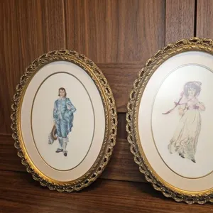 Oval Ornate Gilt Frames with Portrait Prints