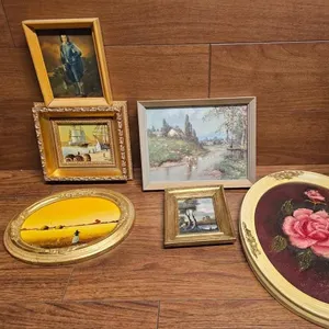 Seven Framed Artworks in Various Styles and Sizes
