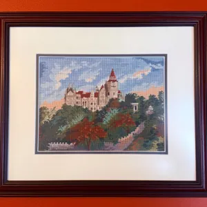 Framed Handcrafted Cross-Stitch Artwork Featuring a Castle Landscape
