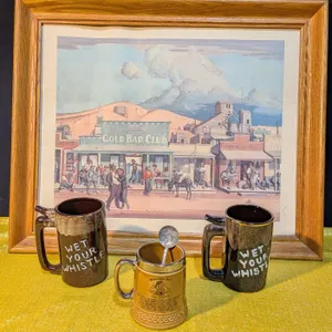 Framed Print of a Street Scene, Stoneware Tankard, and Two Mugs