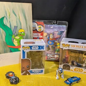 Collection: Hand-Painted TV Animation Cell, Funko Pop Figures, and 1970s Hot Wheel Cars
