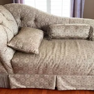 Tufted Chaise Lounge with Floral Upholstery and Accent Pillows
