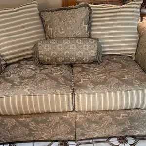 Two-Seat Upholstered Sofa with Floral and Striped Cushion Accents