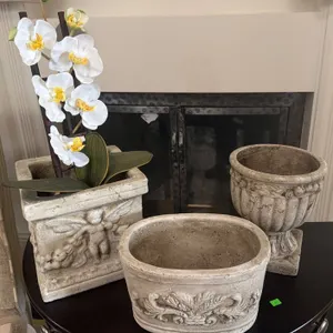 Three Decorative Stone-Look Planters with Ornamental Detail