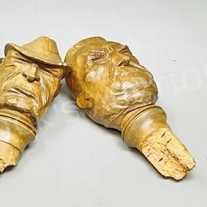 2 hand carved wooden bottle stoppers