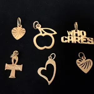SIX APPROX 10K+ CHARMS (3.3G)