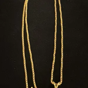 APPROX 10K CHAIN (16") WITH APPROX 14K PENDANT SET WITH CUBIC ZIRCONIA (4.1G)