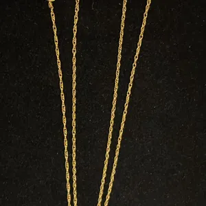APPROX 10K CHAIN (17") WITH APPROX 14K HEART PENDANT SET WITH DIAMONDS (.015CT) & APPROX 14K CLAW...