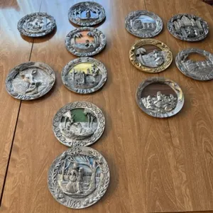 12+/- Michael Ricker Pewter Plates