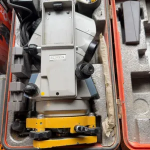 Sokkia surveying instrument housed in a fitted hard case, including power supply and accessories. Th