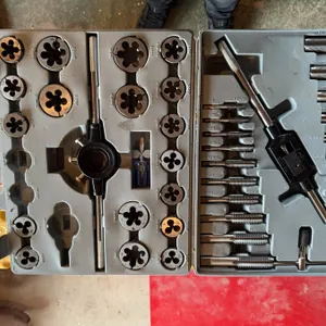 Tap and die set for threading, housed in a hard plastic carry case. Includes multiple dies, taps, ha