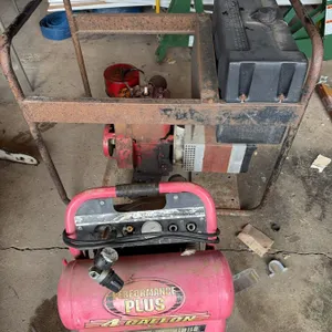 Performance Plus air compressor and a gasoline-powered generator with a 3 HP engine. The generator i