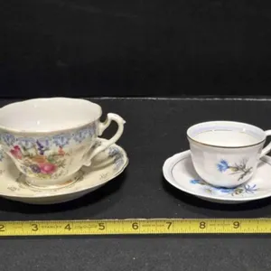 2 teacups & saucers; 1 from Coimbra Portugal