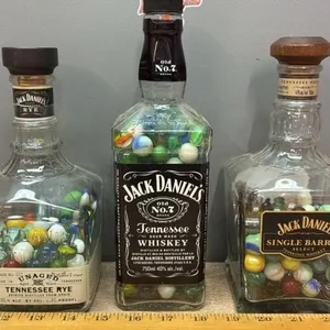 3 Collectible Jack Daniel’s Bottles w/Marbles.