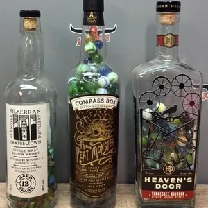 3 Whiskey Collector Bottles w/Marbles.