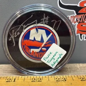 Pierre Turgeon Autographed NY Islanders Puck.