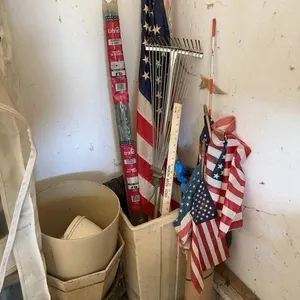 Assorted Garden Stakes Planters Flags and Rake Uti