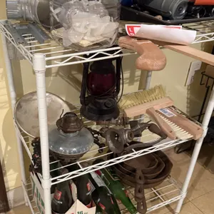 Metal shelf, drain cleaner, caulk gun, and miscellaneous