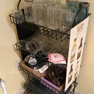 Metal shelf, glass jars, extension cords, etc.