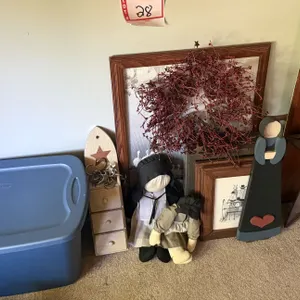 Tote with wrapping items, frames, and pictures and decor