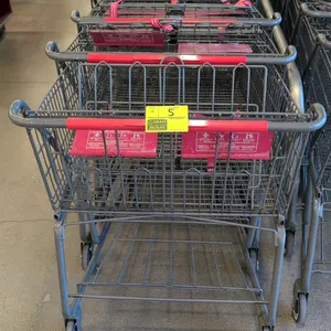 Metal shopping cart. Features a wire basket, child seat with safety belts, and an undercarriage shelf. 42" x 30". Mounted on casters.