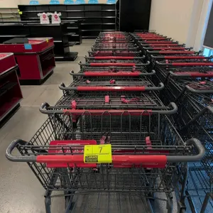 Metal shopping cart. Features a wire basket, child seat with safety straps, and a lower storage tray. 42" x 30". Mounted on casters.