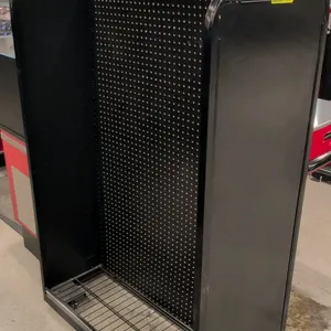 Metal pegboard merchandise rack. Features black metal construction, pegboard backing, and solid side panels. Includes assorted wire shelves. 40"W x 22