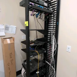 IT rack and networking equipment package. Includes a 7'H CPI 2-post open frame rack with vertical cable management, Avaya IP Office 500V2 control unit