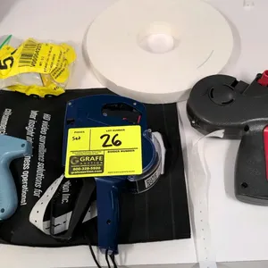 Price tagging gun set. Includes a Perco label gun, an Avery Dennison label gun, and a clothing tagging gun. Includes a roll of labels and a bag of fas