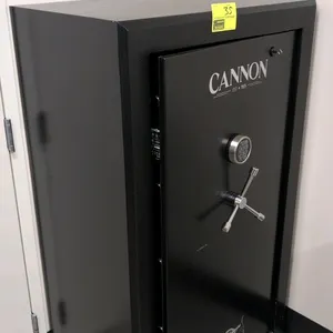 Cannon TS5934 fire-resistant safe. Features electronic keypad lock, 3-spoke handle, carpeted interior with adjustable shelving, and door organizer pan