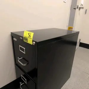 OfficeMax 2-drawer filing cabinet. Features black metal construction with silver-tone handles and label holders. 15"W x 26"D x 28"H.